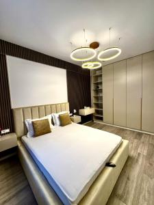 Ένα ή περισσότερα κρεβάτια σε δωμάτιο στο RTS Apartment