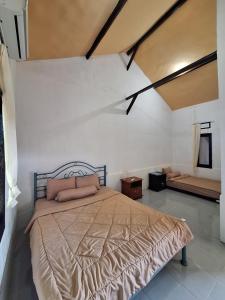 Postel nebo postele na pokoji v ubytování La Calma House