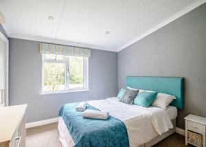 Ένα ή περισσότερα κρεβάτια σε δωμάτιο στο Ladera Retreat Lodges