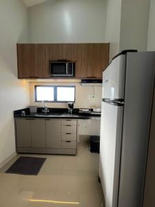 Η κουζίνα ή μικρή κουζίνα στο LOFT 9 - Apartamento Loft 09 Próximo ao Shopping Buriti