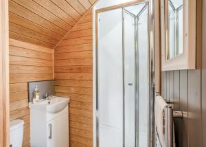 a bathroom with a toilet and a sink and a shower at South View Retreat in Carlton