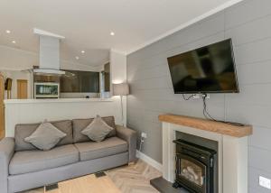 TV a/nebo společenská místnost v ubytování Quarry Walk Lodges + 55 fotografií