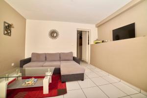 Μια τηλεόραση ή/και κέντρο ψυχαγωγίας στο Alizés un logement unique et spacieux face à la mer