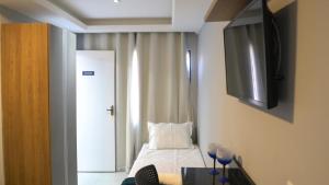 TV a/nebo společenská místnost v ubytování Flats Catamarã