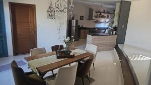 a kitchen and dining room with a table and chairs at Loft 49 Valquirico in Santeagueda