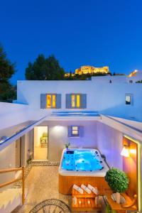 a swimming pool on the roof of a house at Lindos Shore Summer House with Jacuzzi and sea view !!! in Lindos