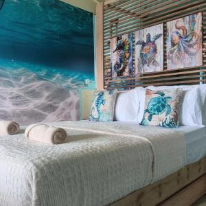 Ένα ή περισσότερα κρεβάτια σε δωμάτιο στο Turtle Garden Lodge