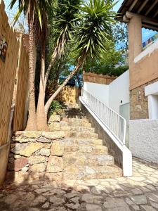 a stone staircase leading up to a house with palm trees at Cinéma Room - La Valette - Toulon - Hyères in La Valette-du-Var