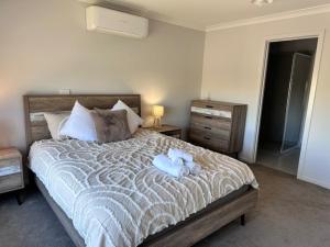 Postel nebo postele na pokoji v ubytování Family Time by the park