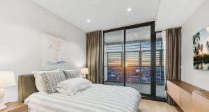 Ένα ή περισσότερα κρεβάτια σε δωμάτιο στο Luxurious 3 Bedroom with Darling Harbour Views