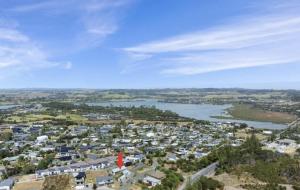 an aerial view of a city and a river at Modern & Central 'Nautical' Chalet - Mangawhai Heads in Mangawhai +3 photos