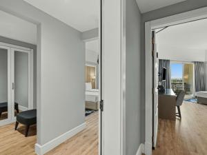 a living room with a view of a bedroom at Rixos Bab Al Bahr - Ultra All Inclusive in Ras al Khaimah +240 photos