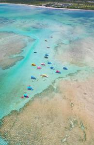 an aerial view of a beach with boats in the water at Casa Tunel in Pôrto de Pedras