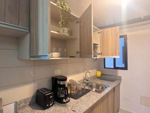 Kuchyň nebo kuchyňský kout v ubytování Condo in Punta Cana