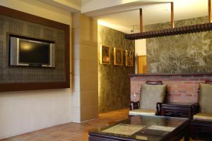 Μια τηλεόραση ή/και κέντρο ψυχαγωγίας στο Constellation Coast B&B +18 φωτογραφίες