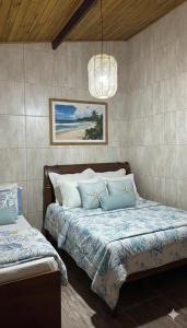 Voodi või voodid majutusasutuse Suíte Maresias com Piscina Aquecida, Mar e Mata Atlantica toas