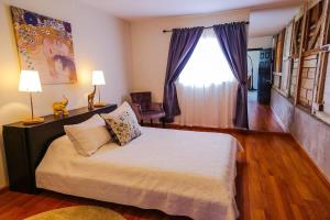 Postel nebo postele na pokoji v ubytování Casa Artistica Valle de Guadalupe AC & WiFi