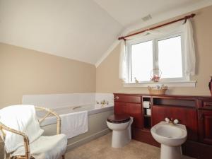 a bathroom with a tub and a toilet and a sink at Arnaval in Fernilea +51 photos