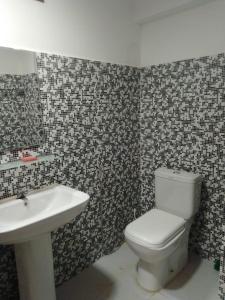 a bathroom with a toilet and a sink at Penthouse Bandarawela in Bandarawela +112 photos