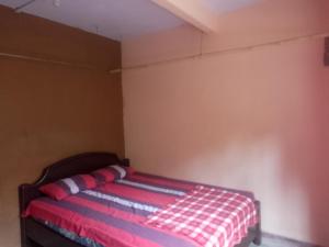 Ένα ή περισσότερα κρεβάτια σε δωμάτιο στο Sehandi Hotel - Arachchi Gedara