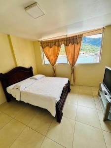 TV a/nebo společenská místnost v ubytování Hostal Copacabanna