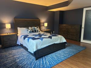 a bedroom with a large bed and two night stands at Rutledge Lake Retreat in Bancroft