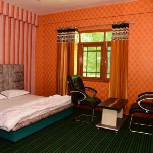 Postel nebo postele na pokoji v ubytování Hotel O Graceland