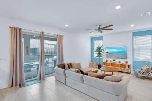 a living room with a couch and a table at 475 Strand Dr in Melbourne Beach