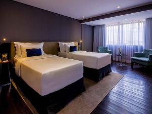 Postel nebo postele na pokoji v ubytování Grand Mercure Brasilia Eixo Monumental + 177 fotografií