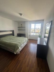 Ένα ή περισσότερα κρεβάτια σε δωμάτιο στο Executive apartment with great view