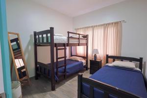 Postel nebo postele na pokoji v ubytování Casa en puntaleona Condomio Bambu + 13 fotografií