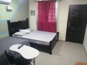 Ένα ή περισσότερα κρεβάτια σε δωμάτιο στο Hostal Ofelina & Hijos