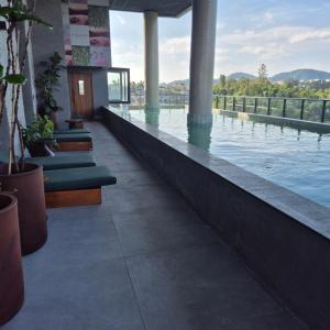a swimming pool with a view of the water at SKY Alphaville in Barueri