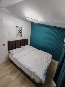 Postel nebo postele na pokoji v ubytování Chi's Homestaycation