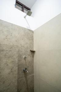 Phòng tắm tại Infinity Rooms Kazhakkoottam Technopark