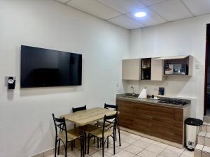 Η κουζίνα ή μικρή κουζίνα στο Atractivo apartamento