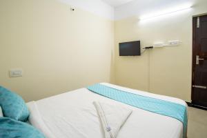 TV/trung tâm giải trí tại Infinity Rooms Kazhakkoottam Technopark +57 ảnh