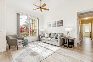 a living room with a couch and a chair at 601 Benedictine Ter in Sebastian