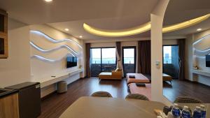 a living room with a couch and a table at Flc Sea Tower - ChillNow Căn hộ View Biển, Cạnh Bãi Tắm Biển in Quy Nhon