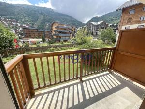 a balcony with a view of a mountain at Studio Cabine Rénové - 4 Couchages - Centre de Valloire - FR-1-854-46 in Valloire