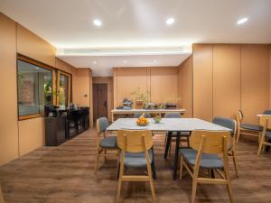 a kitchen and dining room with a table and chairs at Nan she in Datong