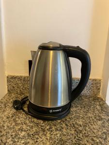 Příslušenství pro přípravu čaje a kávy v ubytování Lince Apartments