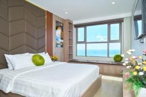 Postel nebo postele na pokoji v ubytování The Song Vũng Tàu - Premium Apartment + 41 fotografií