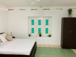 Ένα ή περισσότερα κρεβάτια σε δωμάτιο στο Sen Villa - Rathgama