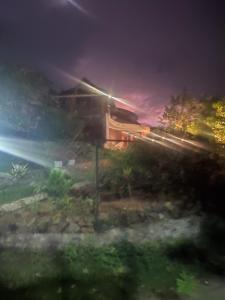 a train is on the tracks at night at Nirvikalpa vagamon in Vagamon +3 photos