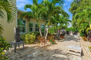 a house with palm trees in front of it at 445 Watts Way in Cocoa Beach