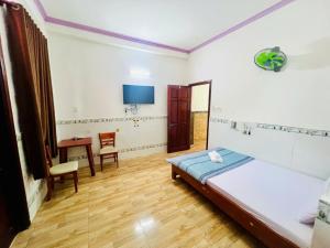 Giường trong phòng chung tại Thuận Phát Motel Bình Dương +15 ảnh