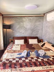 Ένα ή περισσότερα κρεβάτια σε δωμάτιο στο Dansontayakohlibong +52 φωτογραφίες