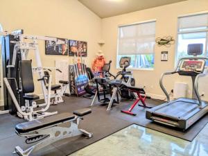 a gym with several exercise equipment in a room at Cape Crossing 104 in Merritt Island
