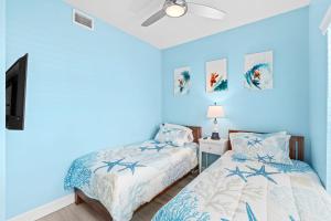 En eller flere senge i et værelse på Versailles Sur La Mer 1D + 34 billeder